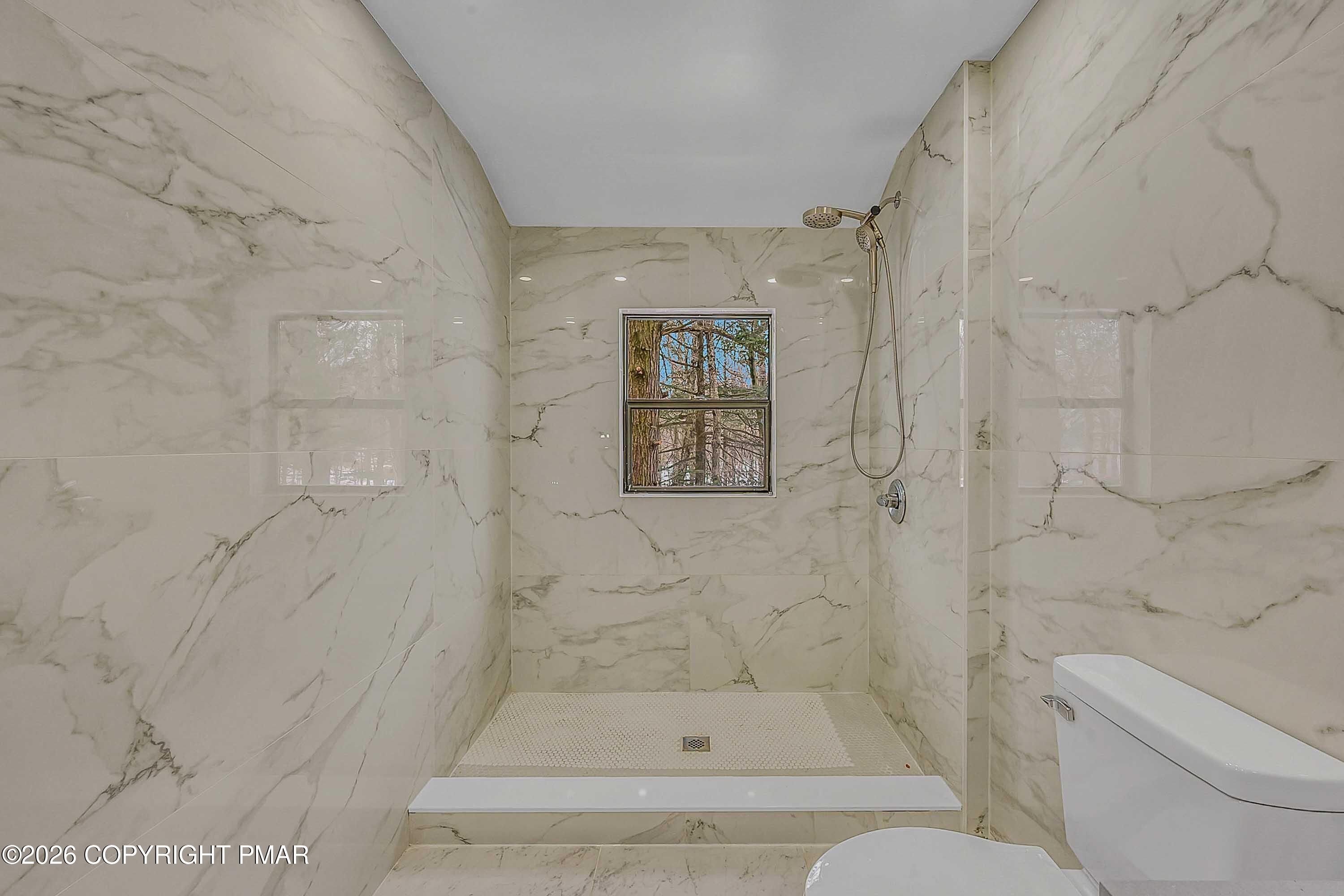 1027 Valley Road Newfoundland, PA 18445 - Photo 22 of 31 a bathroom with a toilet and a shower