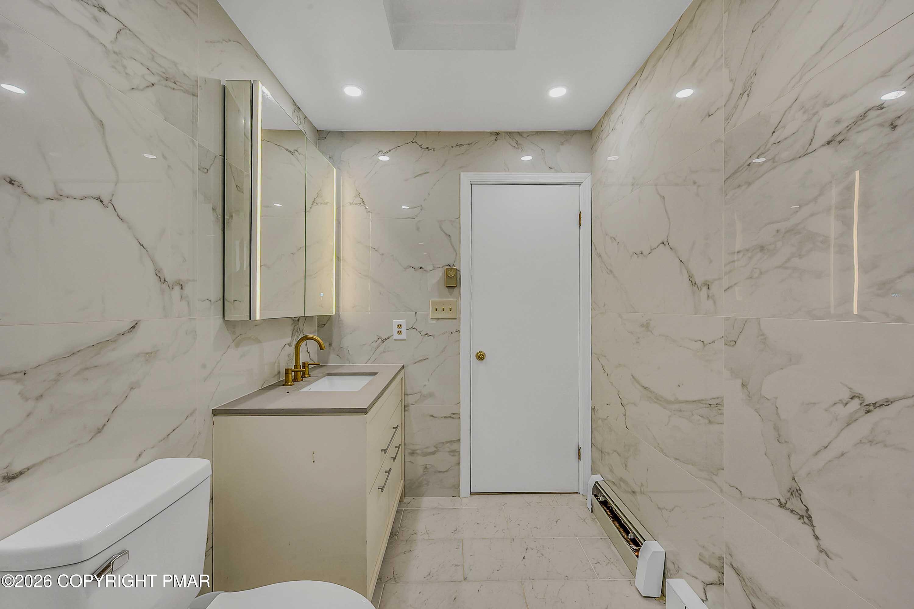 1027 Valley Road Newfoundland, PA 18445 - Photo 23 of 31 a bathroom with a sink toilet and shower