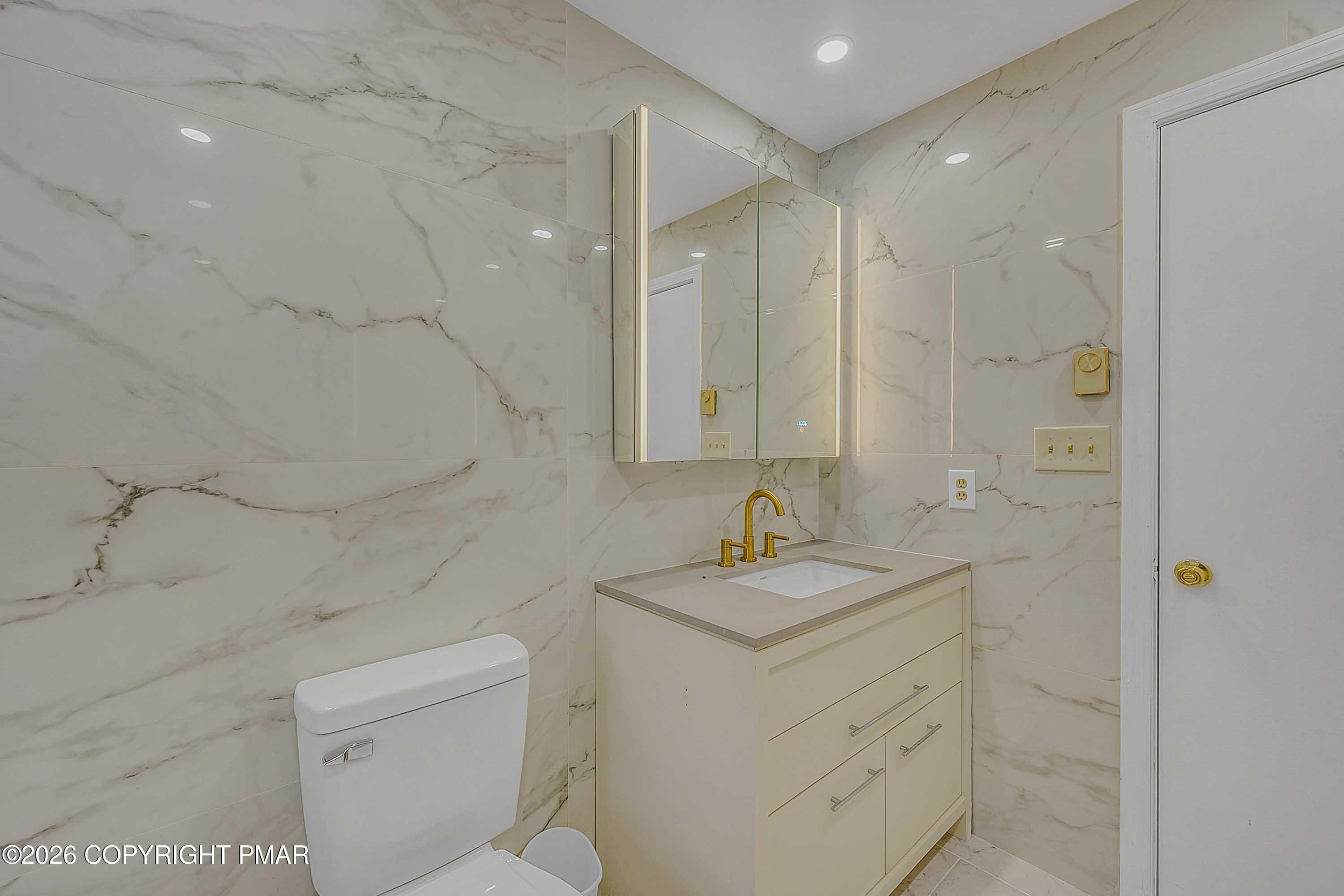 1027 Valley Road Newfoundland, PA 18445 - Photo 24 of 31 a bathroom with a sink toilet vanity and shower