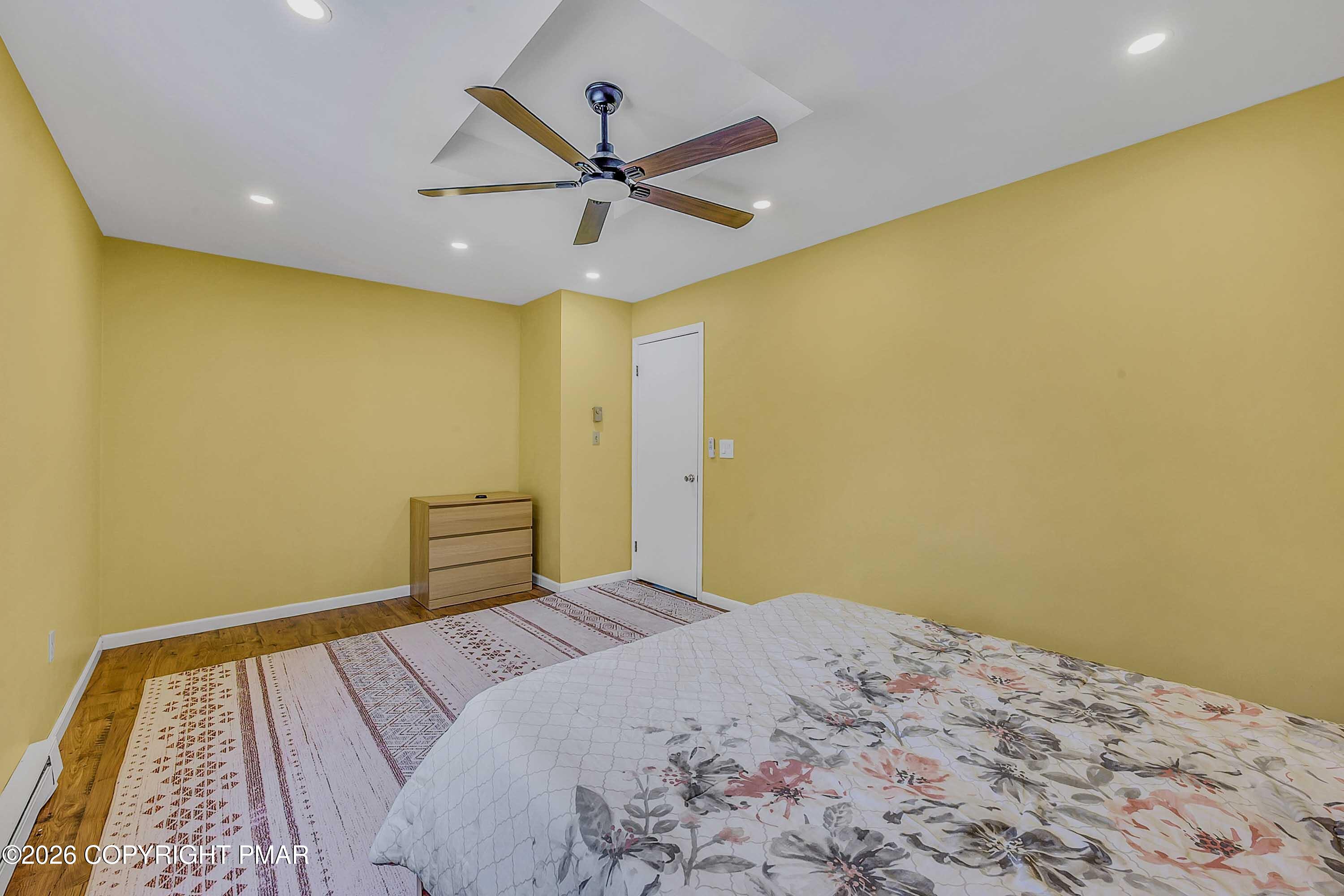 1027 Valley Road Newfoundland, PA 18445 - Photo 26 of 31 a bedroom with a bed and a ceiling fan
