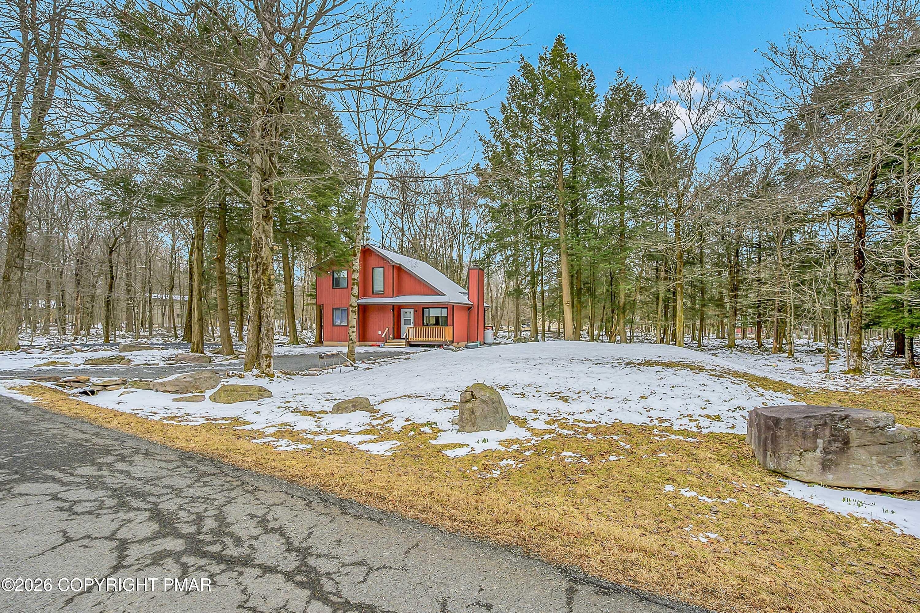 1027 Valley Road Newfoundland, PA 18445 - Photo 5 of 31 a front view of a house with a yard and covered with snow