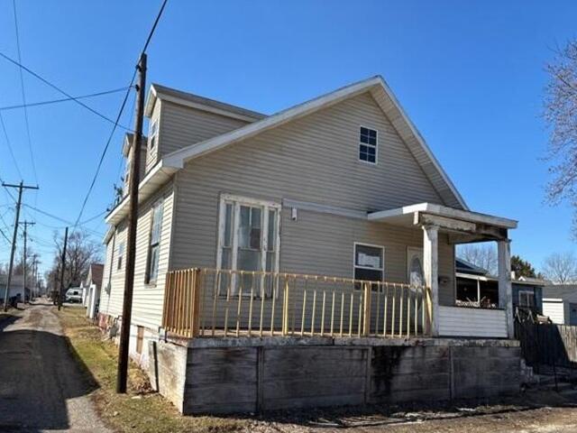 62 South Wayne Street Peru, IN 46970 - Photo 3 of 11 a front view of a house with a porch