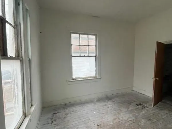 a view of a room that has a window in it