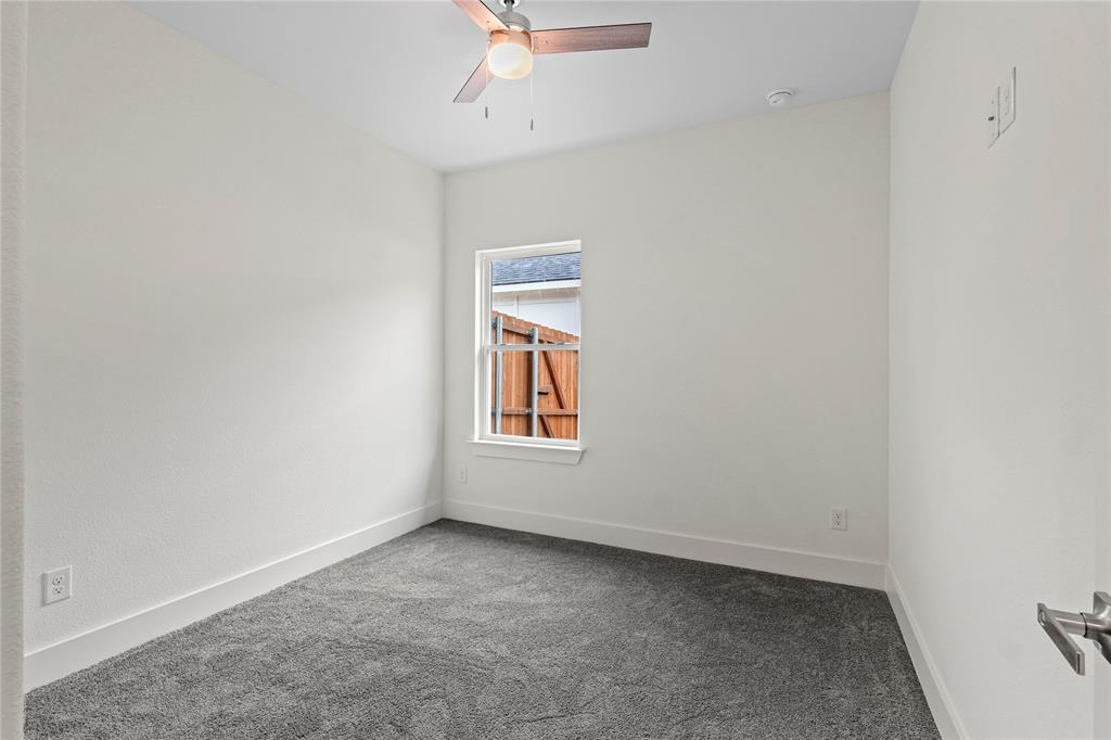 3335 Spring Avenue Dallas, TX 75215 - Photo 17 of 22 an empty room with a window and a fan