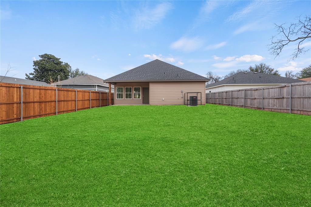 3335 Spring Avenue Dallas, TX 75215 - Photo 22 of 22 a front view of a house with yard and green space