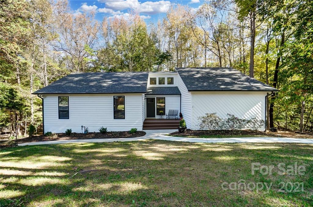 31016 Executive Point, Unit 15 Tega Cay, SC 29708 - Photo 1 of 35 a view of a house with a yard