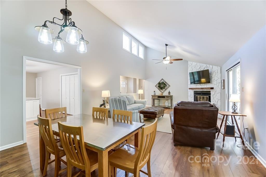 31016 Executive Point, Unit 15 Tega Cay, SC 29708 - Photo 11 of 35 a view of a dining room with furniture and wooden floor