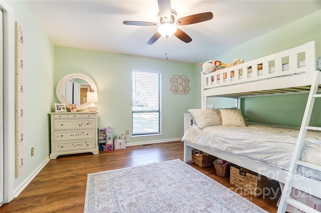 31016 Executive Point, Unit 15 Tega Cay, SC 29708 - Photo 18 of 35 a bedroom with a bed and a dresser