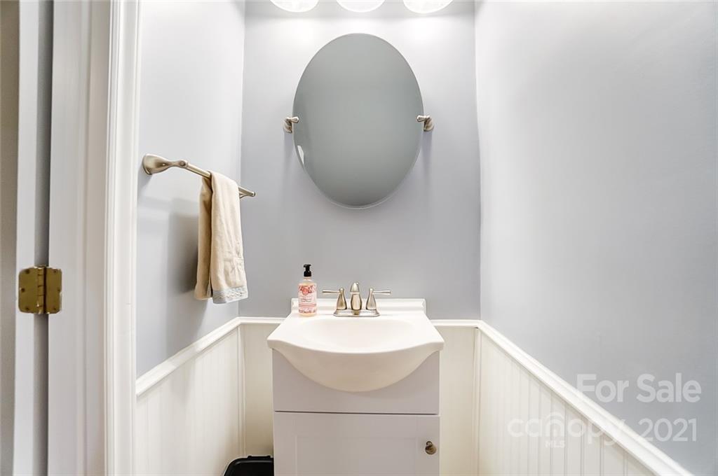 31016 Executive Point, Unit 15 Tega Cay, SC 29708 - Photo 26 of 35 a bathroom with a sink and mirror