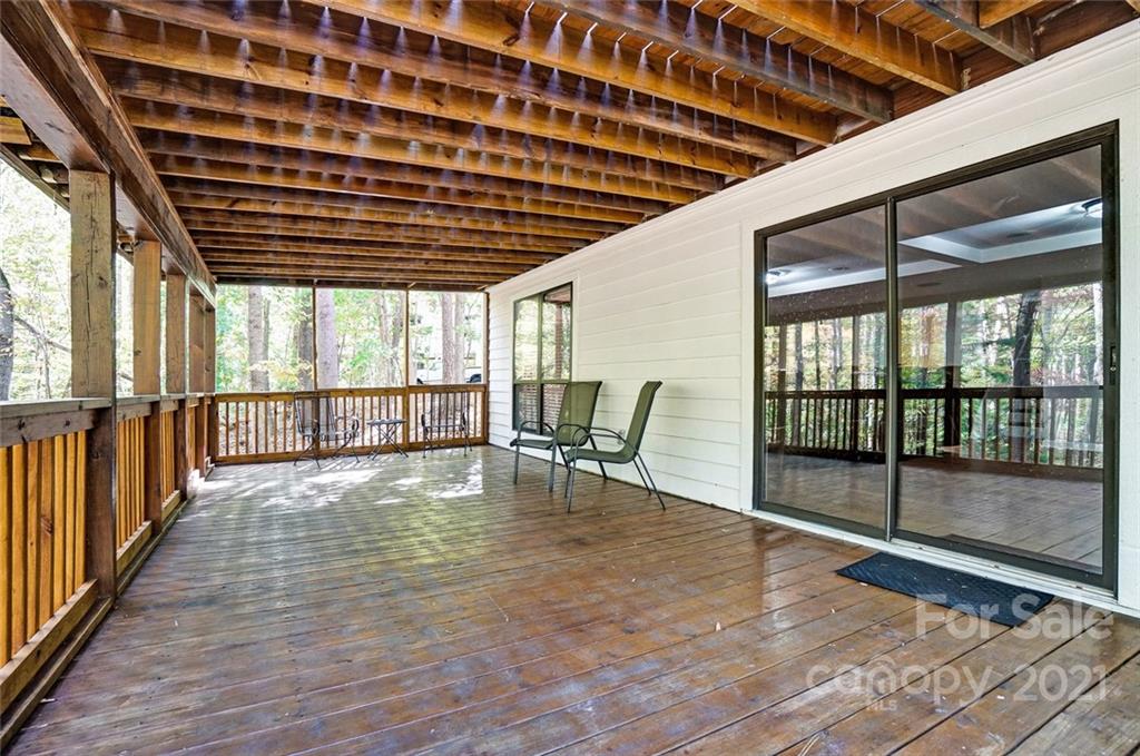 31016 Executive Point, Unit 15 Tega Cay, SC 29708 - Photo 28 of 35 a view of an empty room with wooden floor and a window