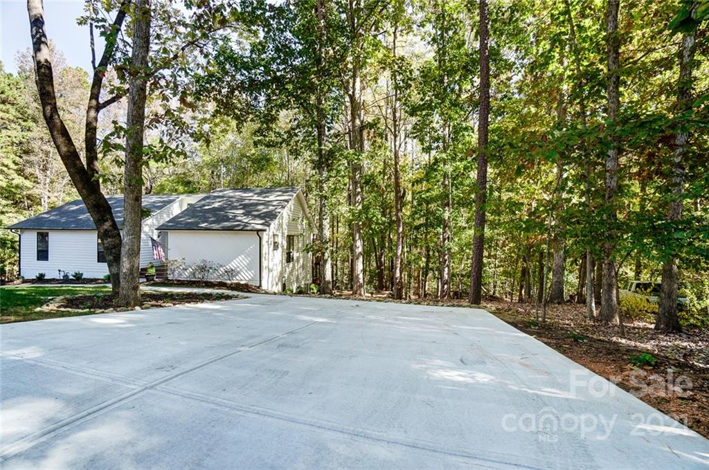 31016 Executive Point, Unit 15 Tega Cay, SC 29708 - Photo 35 of 35 a view of a house with a yard
