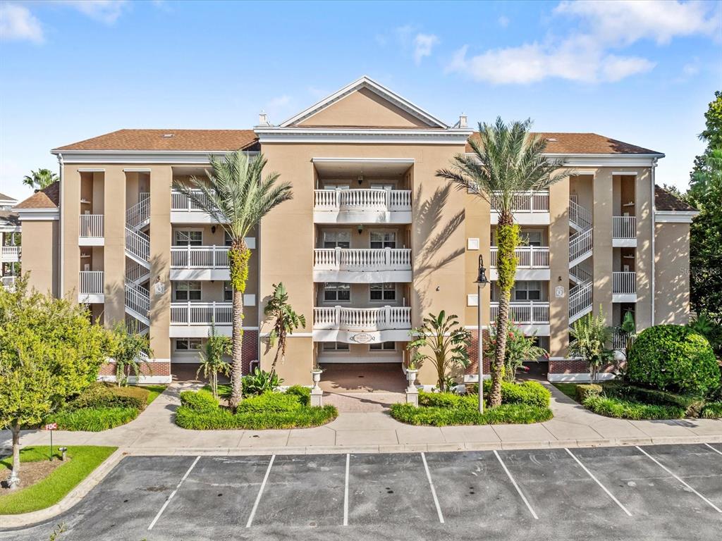 7651 Whisper Way, Unit 401 Reunion, FL 34747 - Photo 1 of 1 a front view of a multi story residential apartment building