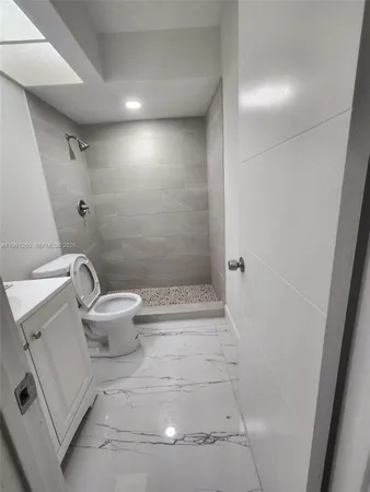 a bathroom with a sink and toilet
