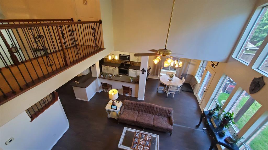 3416 Ridge Lily Lane McKinney, TX 75071 - Photo 15 of 32 Living area featuring a towering ceiling and a ceiling fan