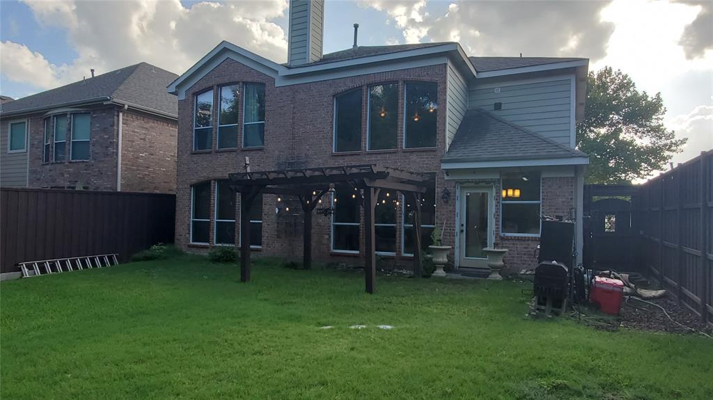 3416 Ridge Lily Lane McKinney, TX 75071 - Photo 20 of 32 Rear view of house featuring a pergola, a chimney, brick siding, and a fenced backyard