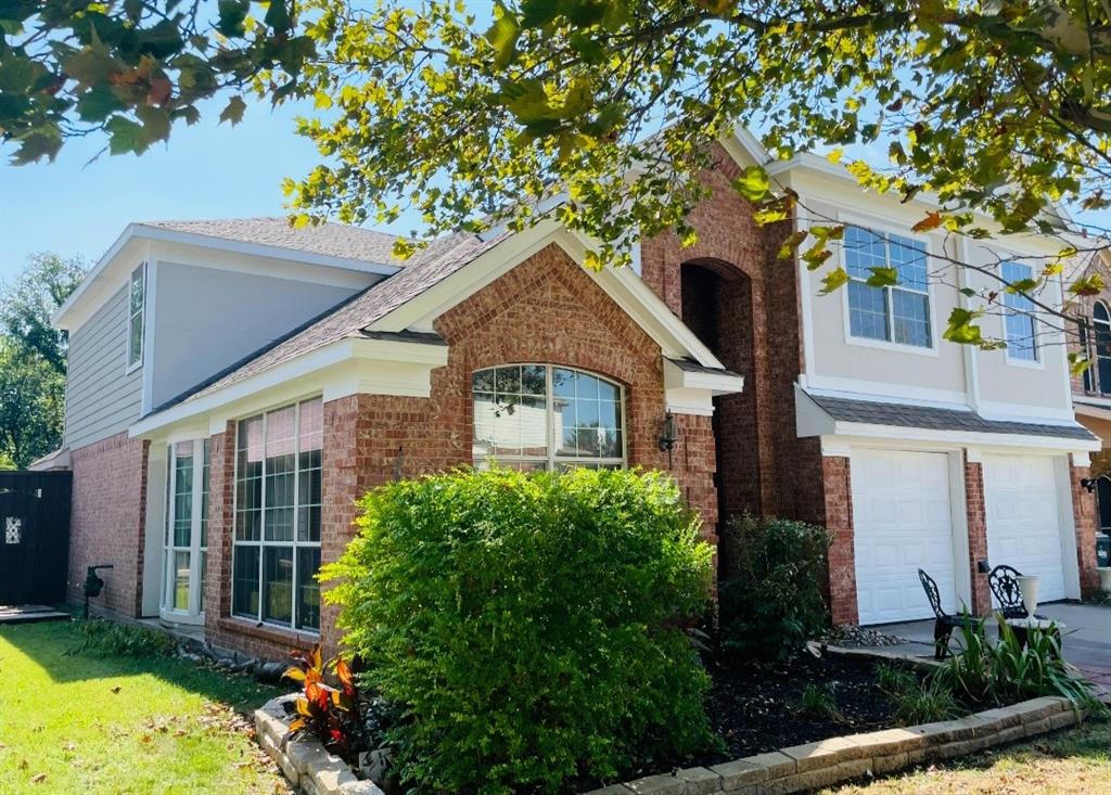 3416 Ridge Lily Lane McKinney, TX 75071 - Photo 2 of 32 Traditional-style house with brick siding, a garage, and roof with shingles