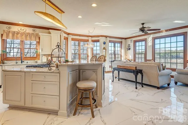 a spacious bedroom with a bed and a large window