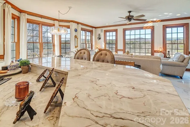 a view of a livingroom with furniture window and outside view