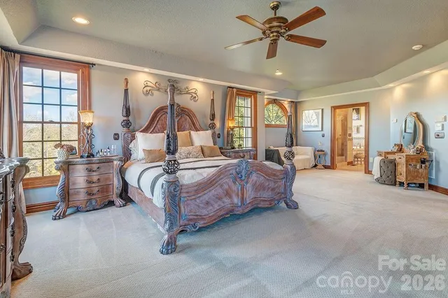 a bed room with a bed and a chandelier