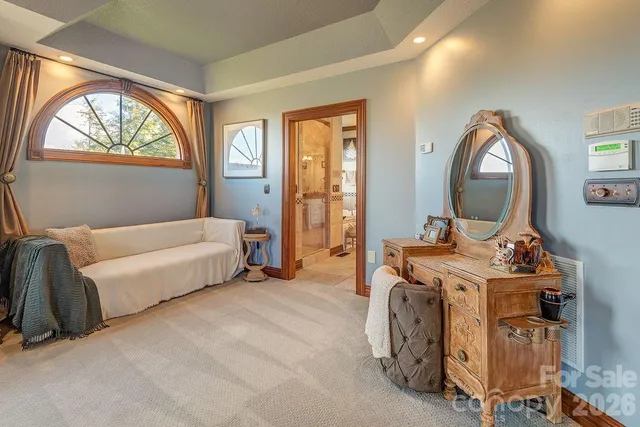 a bedroom with bed and a window