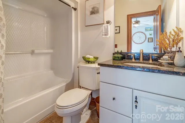 a bathroom with a toilet a sink and a bathtub