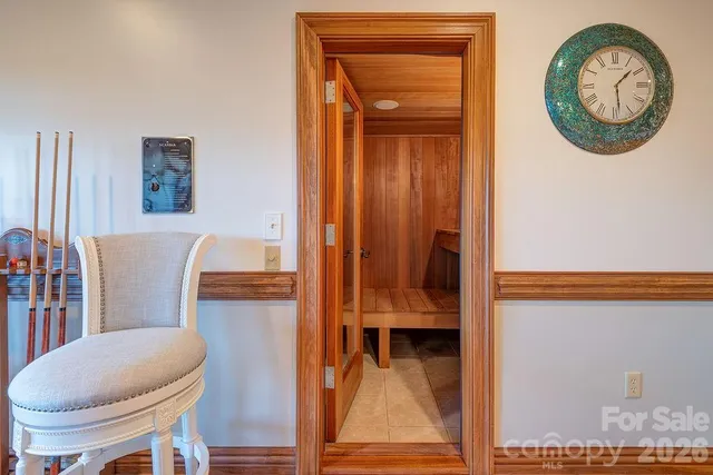 a view of a hallway with entryway wooden floor and a dining room
