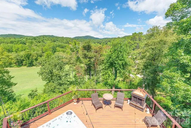 a view of a balcony with mountain view and sitting space