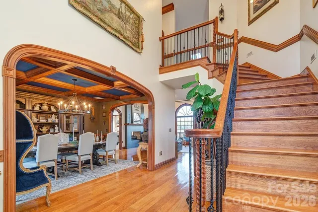 a view of entryway livingroom and hall with wooden floor