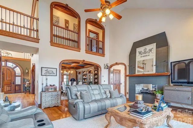 a living room with fireplace furniture and a flat screen tv