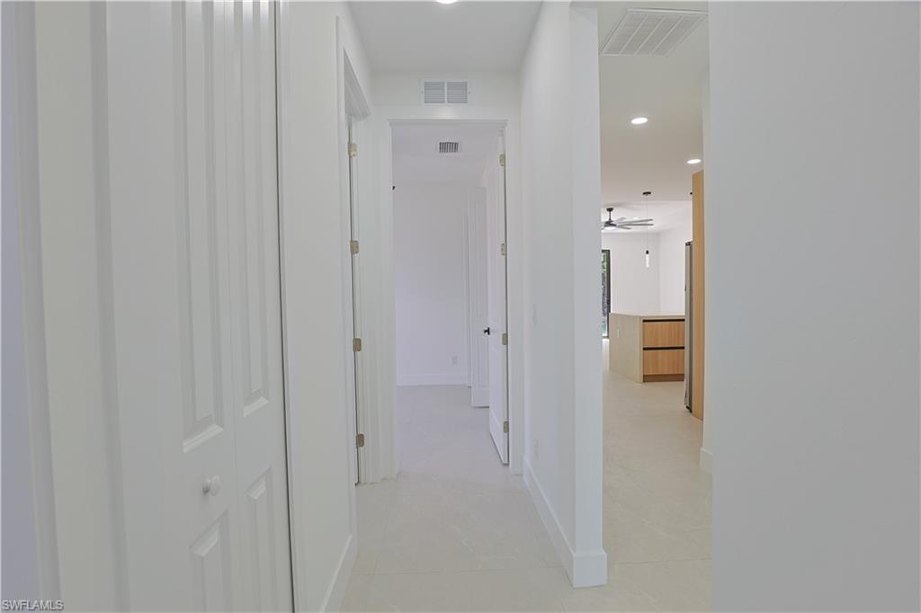 613-615 West 12th Street Lehigh Acres, FL 33972 - Photo 22 of 32 a bathroom with a shower