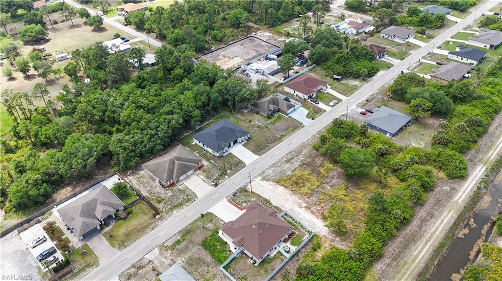 613-615 West 12th Street Lehigh Acres, FL 33972 - Photo 32 of 32 an aerial view of residential house with outdoor space