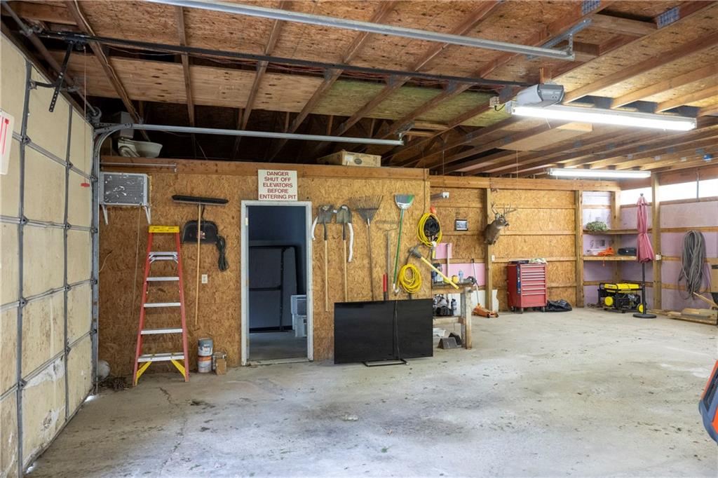 9133 South Watson Run Road Meadville, PA 16335 - Photo 31 of 45 a view of a garage with wooden walls