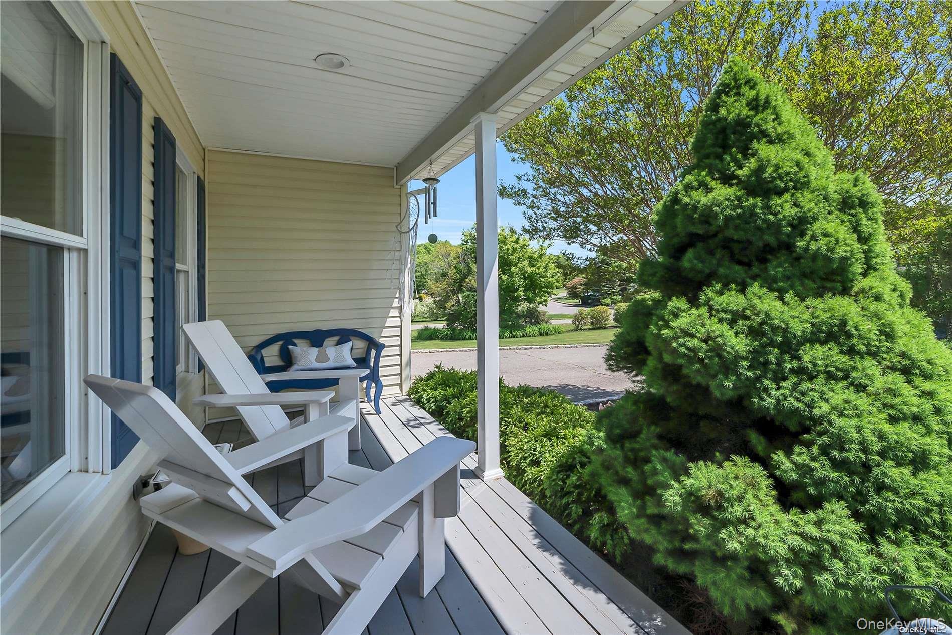 170 Vineyard Way Riverhead, NY 11901 - Photo 2 of 11 a view of a patio with table and chairs and potted plants