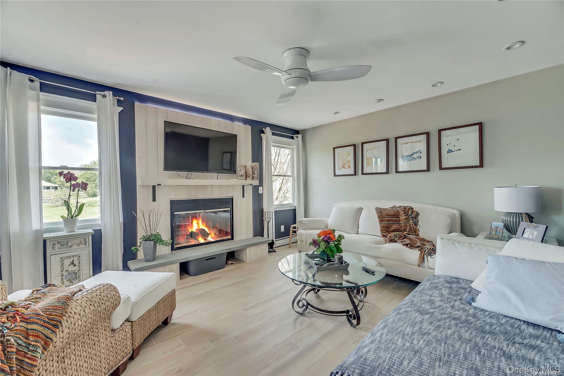 170 Vineyard Way Riverhead, NY 11901 - Photo 3 of 11 a living room with furniture and a fireplace