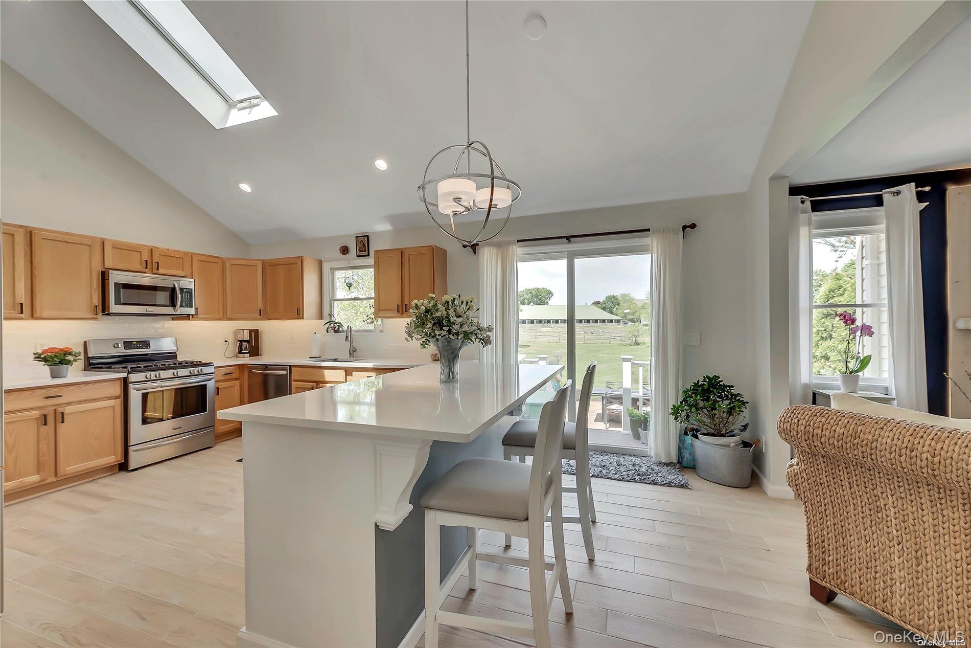 170 Vineyard Way Riverhead, NY 11901 - Photo 5 of 11 a large kitchen with a table and chairs