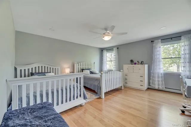 a bedroom with furniture and a window