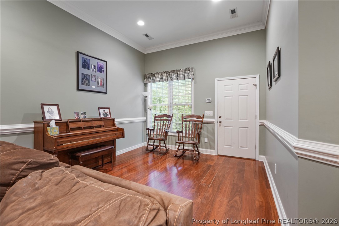 280 Hemp St Extension Robbins, NC 27325 - Photo 18 of 29 a bedroom with furniture and a wooden floor