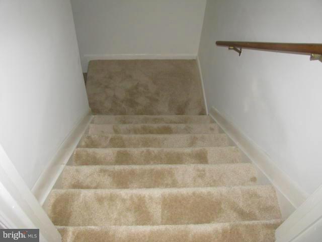 17981 Possum Point Road Dumfries, VA 22026 - Photo 19 of 27 a view of staircase with white walls