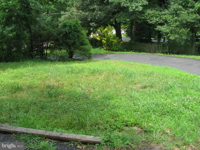 17981 Possum Point Road Dumfries, VA 22026 - Photo 26 of 27 a view of a green yard