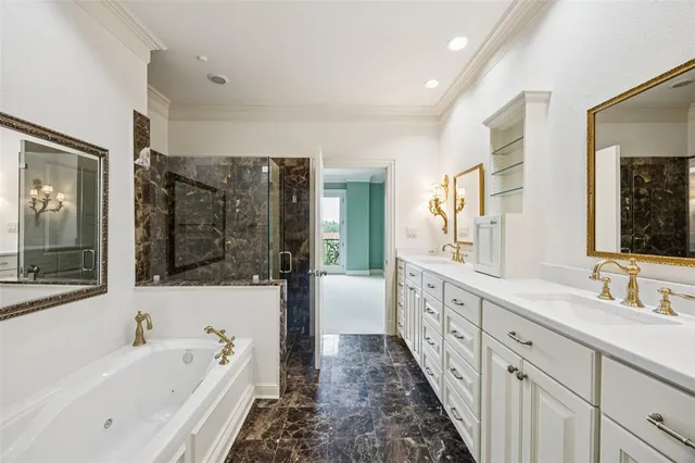 a bathroom with a tub a sink a mirror a shower and a bathtub