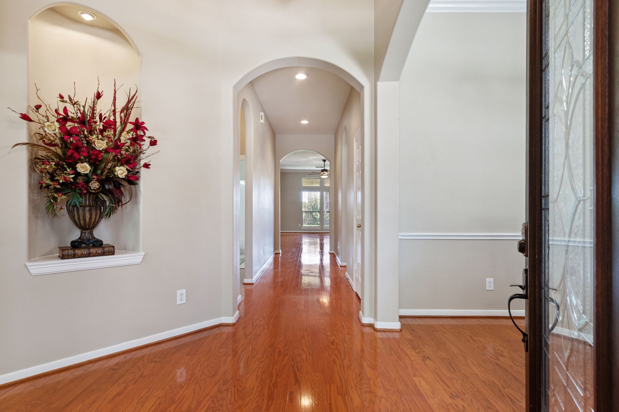 6311 Stone Trail Lane Spring, TX 77379 - Photo 8 of 47 Wood floors in the well appointed foyer flow seamlessly to the back of the home