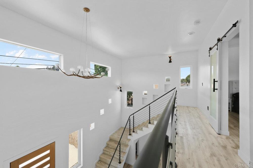 12953 Carriage Road Poway, CA 92064 - Photo 18 of 42 a view of entryway and hall with wooden floor