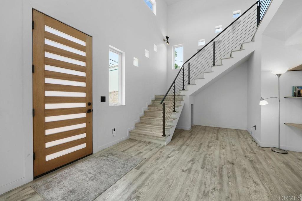 12953 Carriage Road Poway, CA 92064 - Photo 2 of 42 a view of entryway and hall with wooden floor