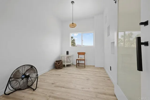 a view of a livingroom with furniture and front door