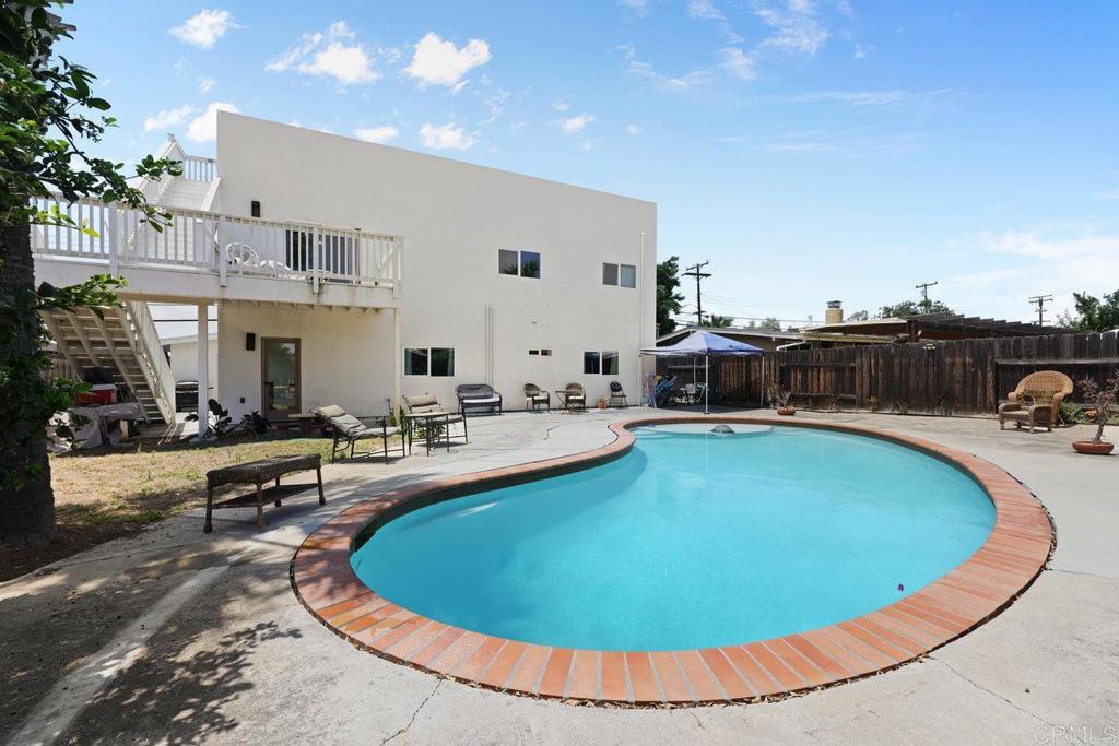 12953 Carriage Road Poway, CA 92064 - Photo 36 of 42 a view of a swimming pool with outdoor seating