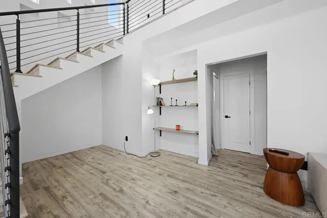 a view of a room with wooden floor and cabinet