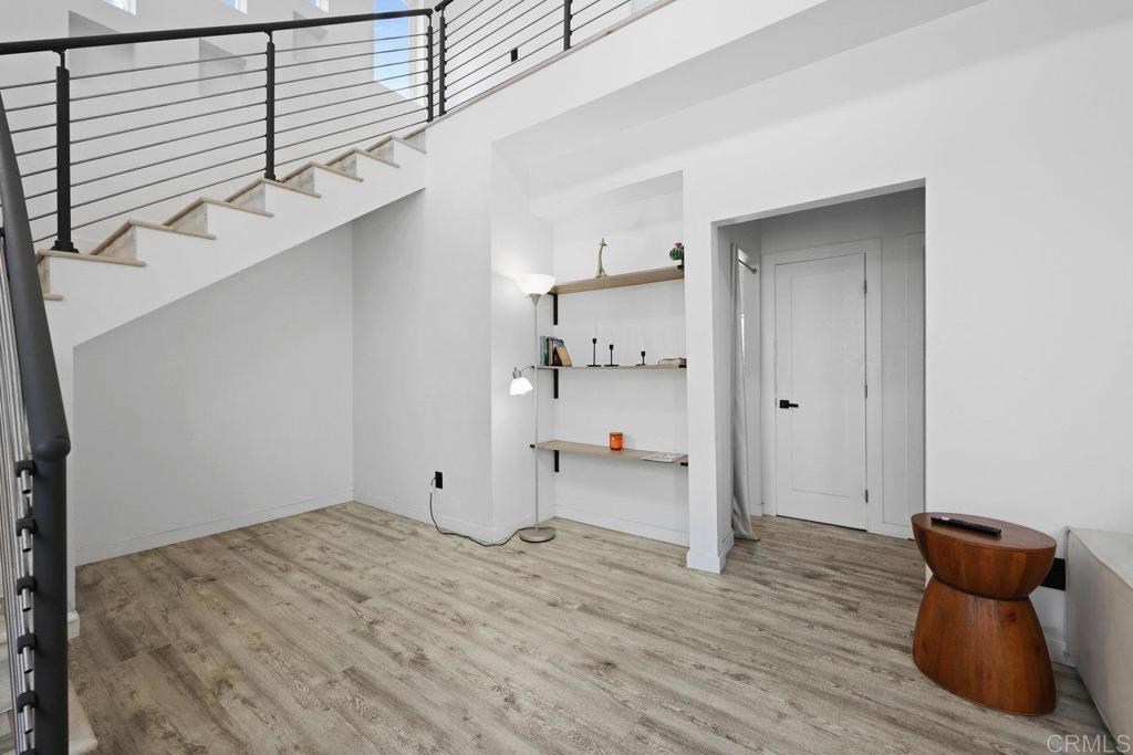12953 Carriage Road Poway, CA 92064 - Photo 4 of 42 a view of a room with wooden floor and cabinet