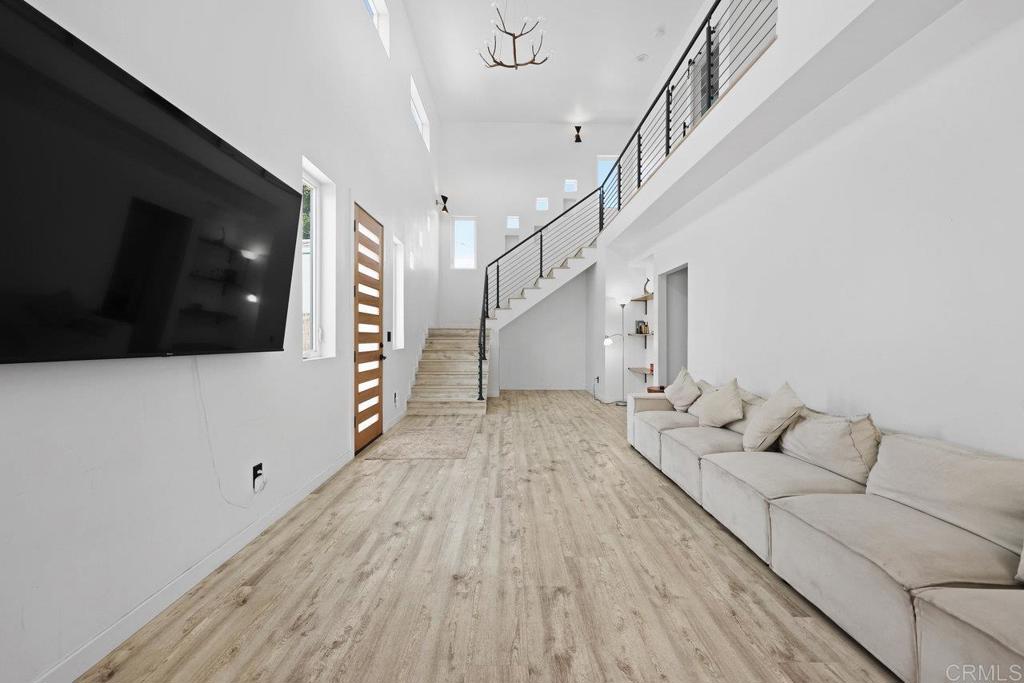 12953 Carriage Road Poway, CA 92064 - Photo 5 of 42 a living room with furniture and a flat screen tv