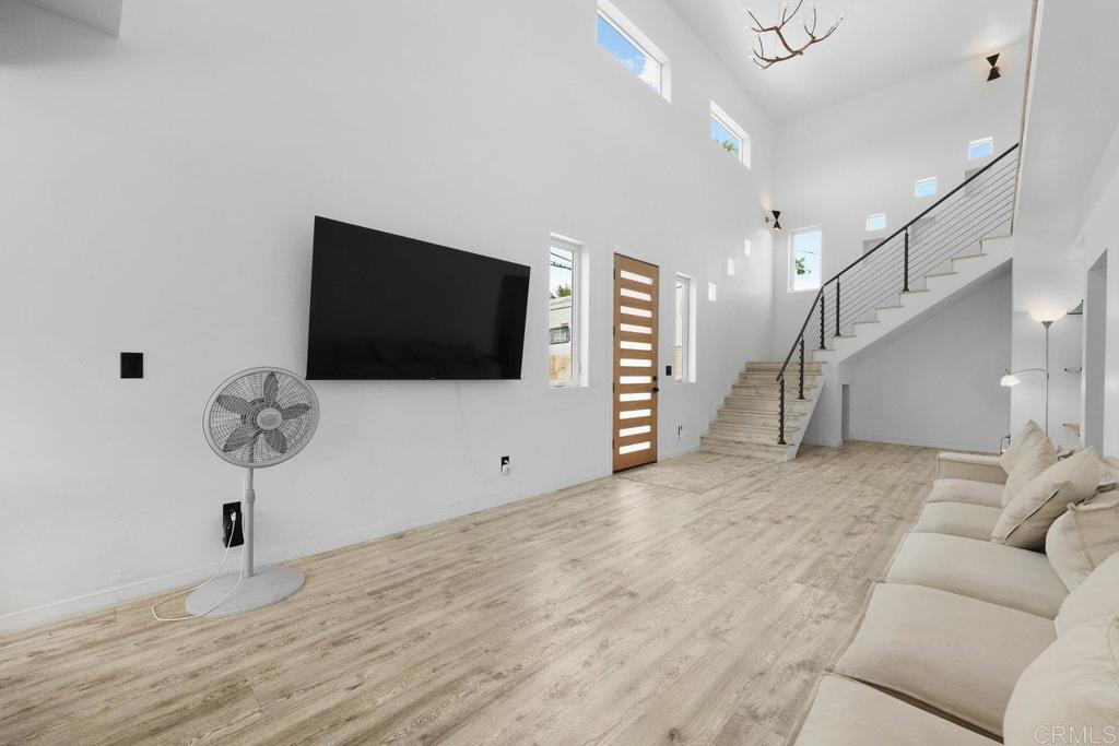 12953 Carriage Road Poway, CA 92064 - Photo 6 of 42 a living room with furniture and a flat screen tv