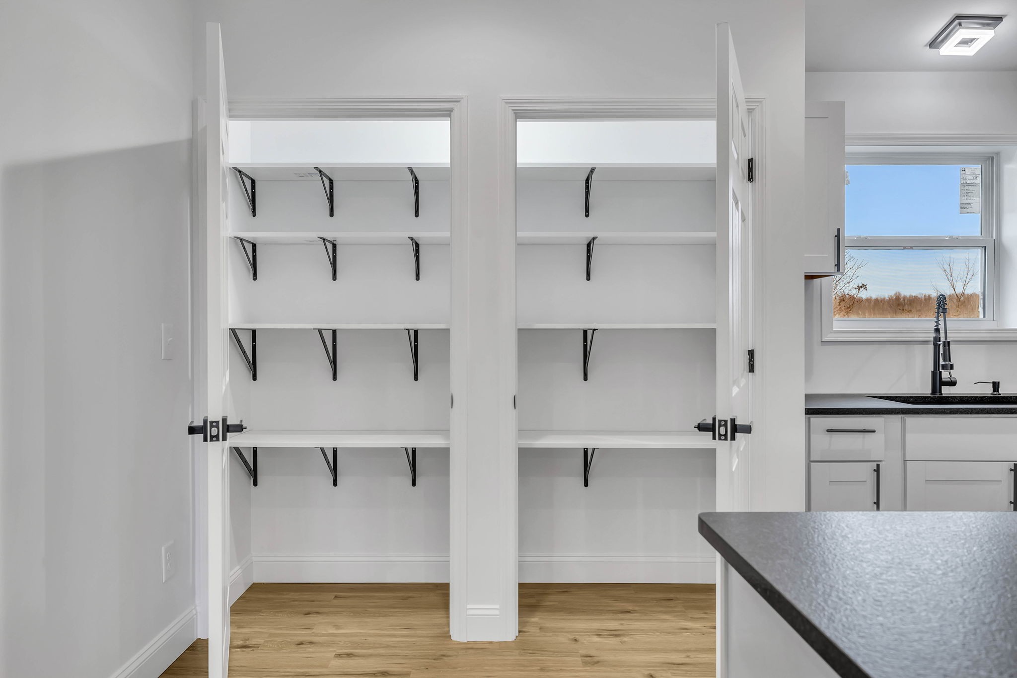 129 Colonial Road Hohenwald, TN 38462 - Photo 17 of 33 a view of a kitchen with wooden floor